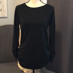 Black shirt with gathered edges and sleeves